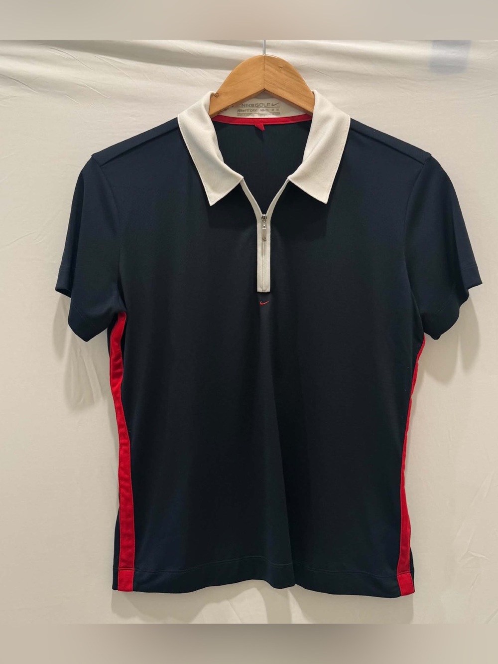 Nike Men’s Navy Polo with White Zip Collar and Red Side Panels